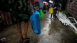 Kenaikan muka air laut telah mengancam keberadaan pulau pemukiman yang bernama Gardi Sugdub di Panama. (MARTIN BERNETTI / AFP)