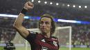 Selebrasi bek Flamengo, David Luiz setelah mengalahkan Corinthians pada laga leg kedua perempatfinal Copa Libertadores di Maracana Stadium, Brasil (9/8/2022). David Luiz yang kini memasuki musim ke-3 bersama Flamengo ini dilahirkan pada 22 April 1987 di Diadema, Brasil. (AFP/Carl De Souza)