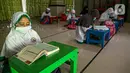 Anak-anak belajar mengaji di Masjid At-Taqwa, Jakarta, Rabu (14/4/2021). Guna mengantisipasi penyebaran virus corona COVID-19, anak-anak yang belajar dan beribadah di Masjid At-Taqwa diimbau untuk menerapkan protokol kesehatan. (Liputan6.com/Faizal Fanani)