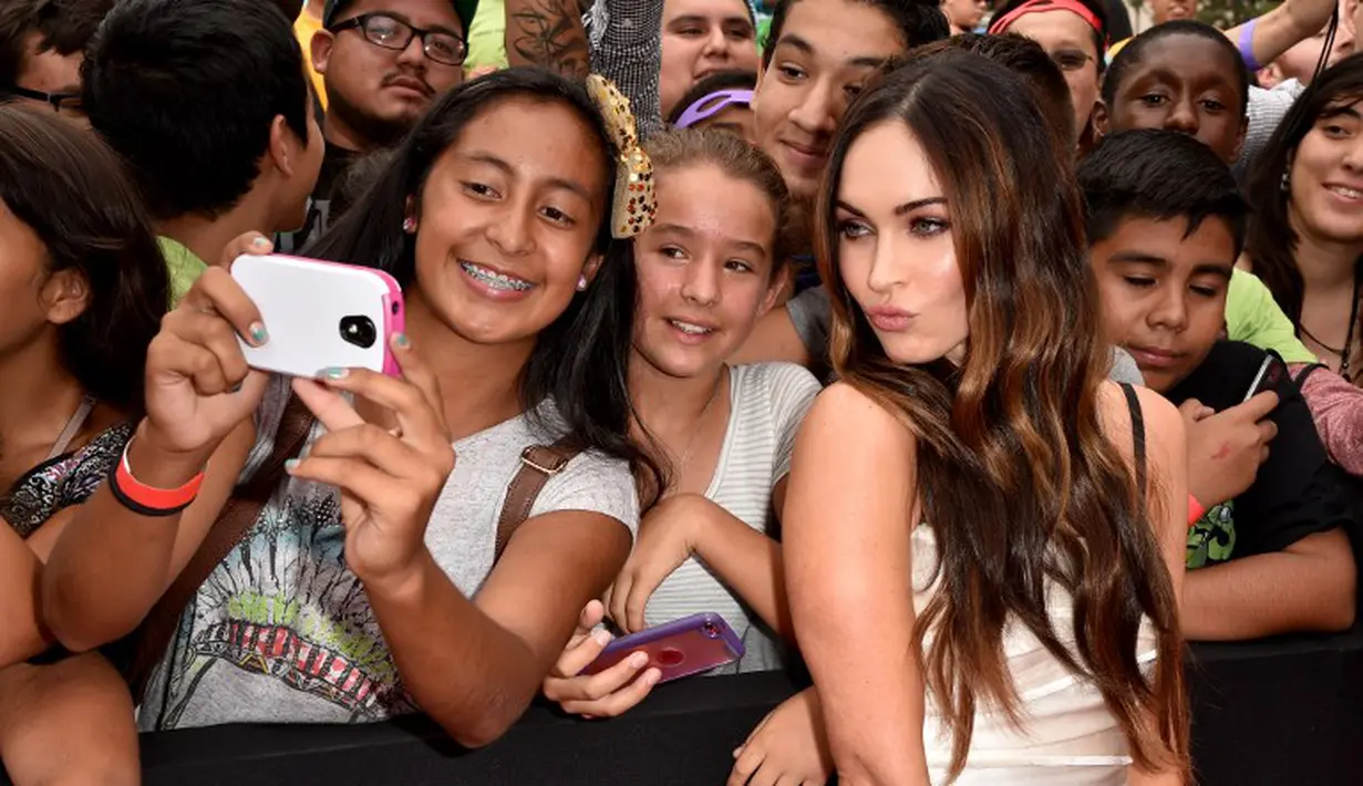 Wanita 28 tahun ini terlihat ramah menyapa para penggemar di acara peluncuran film tersebut, California, (3/8/14). (Kevin Winter/Getty Images for Paramount Pictures/AFP)