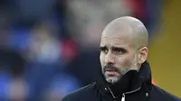 Manajer Manchester City, Pep Guardiola, bicara soal peluang timnya finis empat besar pada musim 2016-2017. (AFP/Ben Stansall)