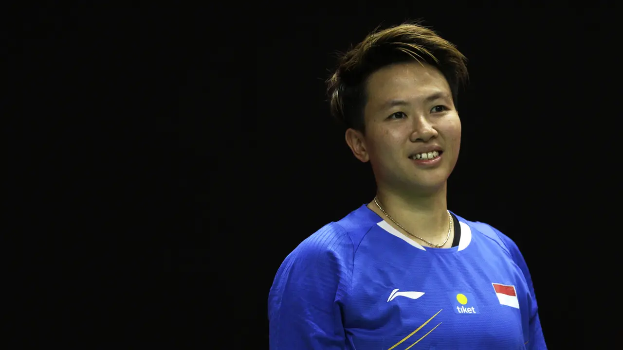 Ganda campuran Indonesia, Liliyana Natsir, tersenyum saat melawan ganda Malaysia pada Indonesia Masters 2019. (Bola.com/Yoppy Renato)