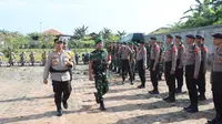 Gelar pasukan Operasi Ketupat Lancang Kuning untuk mengamankan arus mudik Lebaran Idul Fitri di Polres Rokan Hulu. (Liputan6.com/M Syukur)