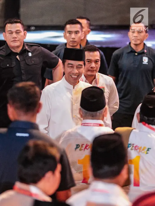 Presiden Joko Widodo tiba menghadiri konsolidasi calon legislatif Partai Kebangkitan Bangsa (PKB) Pemilu 2019 sekaligus haul Abdurrahman Wahid, Gus Dur di Balai Sarbini, Jakarta, Senin (17/12). (Liputan6.com/Faizal Fanani)