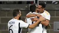 Pemain Real Madrid Joselu (tengah) merayakan gol kedua timnya saat pertandingan sepak bola persahabatan pramusim antara Real Madrid dan Manchester United di Stadion NRG, Houston, Texas, Amerika Serikat, Rabu (26/7/2023). (Mark Felix/AFP)