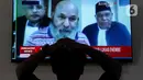 Sidang Lukas Enembe yang digelar secara online (virtual) tersebut atas rekomendasi dari KPK, dengan alasan kesehatan Lukas.Liputan6.com/Herman Zakharia)