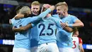 Gelandang Manchester City, Fernandinho bersama rekan setimnya merayakan gol ke gawang West Bromwich Albion pada laga pekan ke-25 Premier League di Etihad Stadium, Kamis (1/2). Manchester City membenamkan West Bromwich dengan skor 3-0. (Oli SCARFF/AFP)