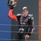 Pembalap Aprilia Racing, Marco Bezzecchi, merayakan posisi ketiga pada MotoGP Aragon, di Sirkuit Motorland, Minggu (30/8/2026). (Pierre-Philippe Marcou/ AFP)