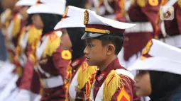Polisi Cilik melakukan aksi baris-berbaris  saat CFD di kawasan Budaran HI, Jakarta, Minggu (3/7/2022). Aksi ini dalam rangka memeriahkan HUT ke-76 Bhayangkara. (Liputan6.com/Angga Yuniar)