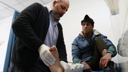 Dalam waktu kurang dari dua dekade sekitar 8.367 pasien dari berbagai negara Timur Tengah yang sedang berkonflik, seperti Irak, Yaman, Palestina, Sudan, Libya dan Suriah, mendapat perawatan.di Rumah Sakit Al-Mosawah di di Amman, Yordania. (Khalil MAZRAAWI/AFP)