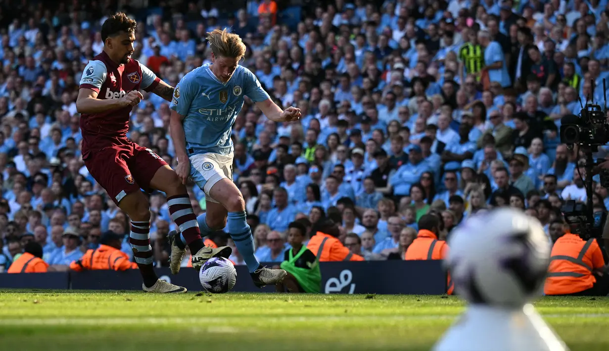 City unggul dua angka dari Arsenal yang di saat bersamaan mengalahkan Everton 2-1. (Oli SCARFF / AFP)