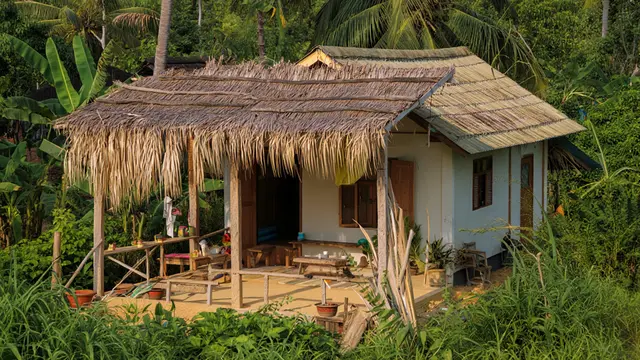 Desain Rumah Minimalis di Desa dengan Pergola Alami (AI)
