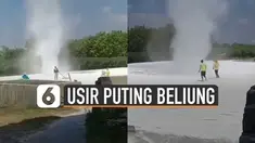 Biasanya angin puting beliung dihindari oleh masyarakat. Tetapi berbeda dengan angin puting beliung ini. beberapa warga berusaha mengusirnya.