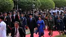 Presiden SBY beserta istri, Ani Yudhoyono, saat masuk ke kompleks upacara peringatan Hari Kesaktian Pancasila di Monumen Lubang Buaya, Jakarta, (1/10/14). (Liputan6.com/Johan Tallo)