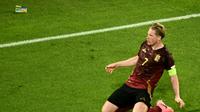 Gelandang Timnas Belgia, Kevin De Bruyne, berselebrasi setelah mencetak gol ke gawang Rumania dalam laga matchday kedua Grup E Euro 2024 di Cologne Stadium, Minggu (23/6/2024) dini hari WIB. Belgia menang 2-0 dalam pertandingan tersebut. (Angelos Tzortzinis / AFP)
