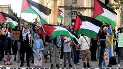Aksi unjuk rasa pro-Palestina digelar di Guadalajara, Meksiko, Selasa (7/10/2025). Mereka menuntut segera diakhirinya agresi militer Israel di seluruh wilayah Gaza. (Ulises RUIZ/AFP)