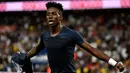 Penyerang PSG, Timothy Weah berselebrasi usai mencetak gol ke gawang Caen pada pertandingan perdana Ligue 1 di Parc des Princes, Paris (12/8). Putra Presiden Liberia ini mencetak gol pertamanya di Ligue 1. (AFP Photo/Gerard Julien)