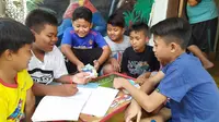 Anak-anak di Bogor arisan kurban sapi. (Liputan6.com/Achmad Sudarno)