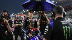 Fabio Quartararo. Pembalap Prancis berusia 22 tahun yang memperkuat tim Monster Energy Yamaha ini merupakan juara dunia MotoGP Musim 2021 lalu. Pada seri pertama MotoGP 2022 di Qatar ia yang start dari posisi ke-11 ini hanya finis di posisi ke-9 akibat kendala tekanan ban depan. (AFP/Karim Jaafar)
