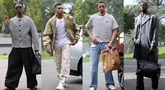 Kedatangan pemain Timnas Prancis sering menyita perhatian karena momen tersebut bak fashion show. Para pemain skuad Les Bleus terlihat mengenakan busana modis menjelang laga Grup D Kualifikasi Piala Dunia 2026 zona Eropa melawan Azerbaijan dan Islandia, Senin (06/10/2025). (AFP/Franck Fife)