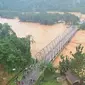 Banjir yang merendam Kabupaten Konawe Utara memutuskan sejumlah akses transportasi di wilayah itu, Minggu (9/6/2019). (Foto: Oheo)