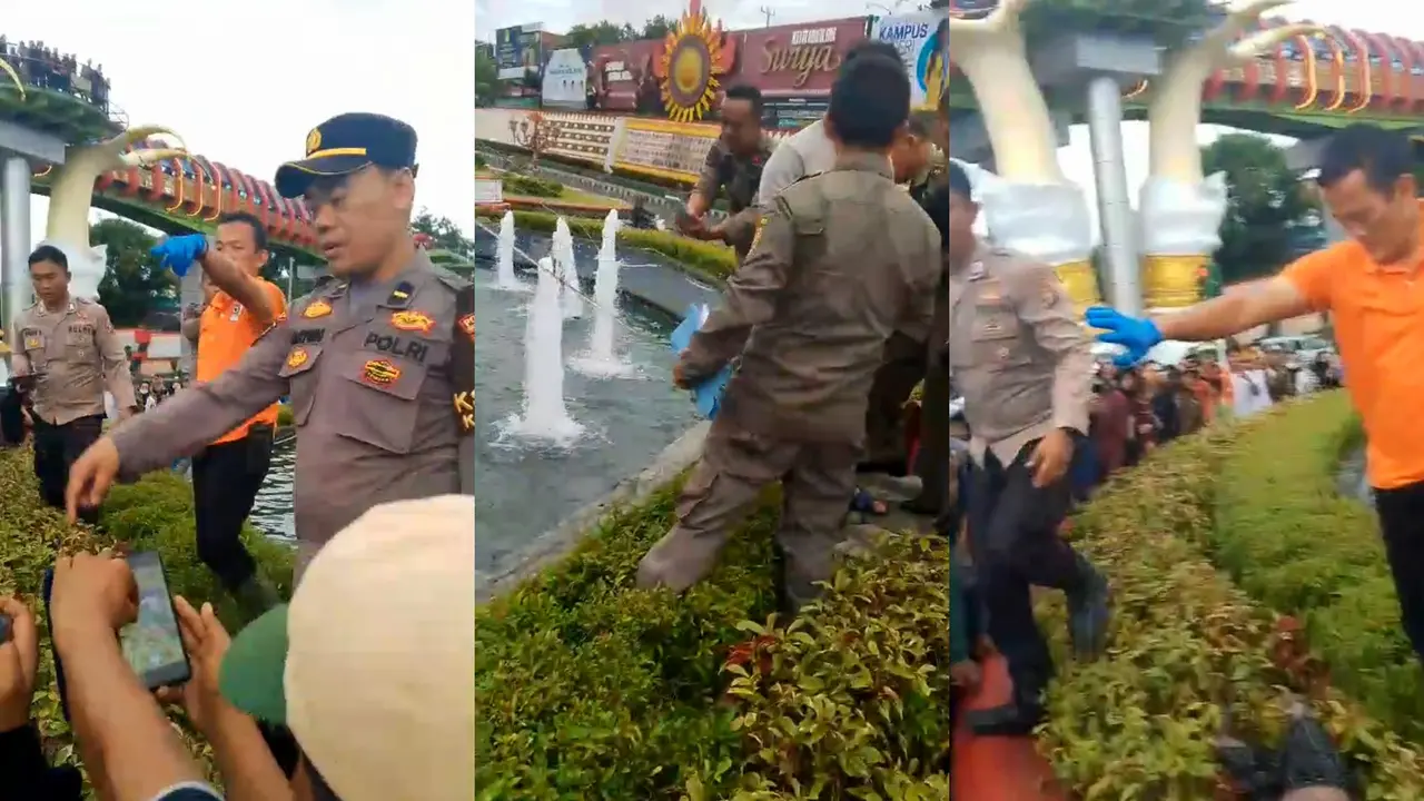 Tangkapan layar rekaman video amatir warga saat petugas polisi melakukan evakuasi mayat bocah di Tugu Pengantin Kota Bandar Lampung. Foto : (Istimewa).