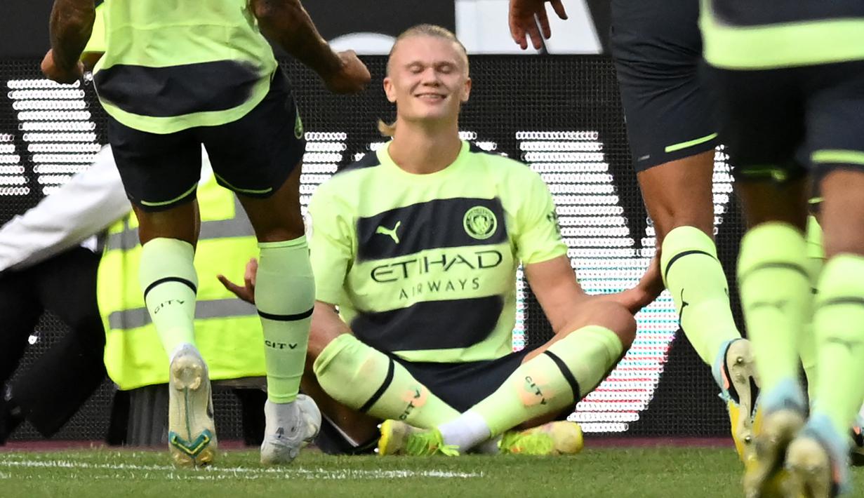 Erling Haaland tampil impresif dengan mencetak dua gol kemenangan Manchester City di Liga Inggris 2022/2023 saat bertamu ke markas West Ham United, Minggu (07/08/2022) malam. (AP/Frank Augstein)