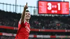 Pemain Arsenal, Granit Xhaka melakukan selebrasi setelah mencetak gol keempat timnya ke gawang Leeds United pada laga pekan ke-29 Liga Inggris 2022/2023 di Emirates Stadium, London, Minggu (02/04/2023) dini hari WIB. The Gunners menang dengan skor 4-1. (AFP/Glyn Kirk)