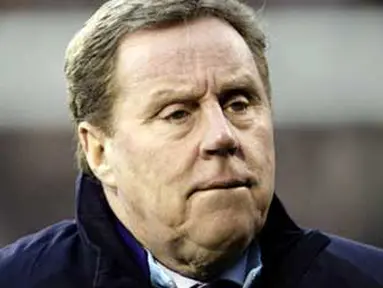 Manager of Tottenham Hotspurs Harry Redknapp awaits kick off against Fulham during a FA Cup fourth round football match at Craven Cottage in London, England, on January 30, 2011. AFP PHOTO/Ian Kington
