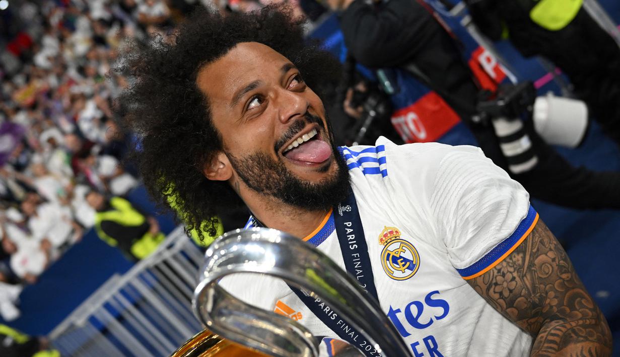 Marcelo bergabung dengan Los Blancos dari Fluminense pada 2007 dengan total 546 penampilan dan 38 gol di seluruh kompetisi. Selama itu, Marcelo sudah memberikan 25 trofi sekaligus jadi pemain dengan gelar terbanyak sepanjang sejarah Los Blancos. (AFP/Paul Ellis)