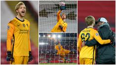 Kiper Liverpool, Caoimhin Kelleher, menepis bola saat melawan Ajax Amsterdam di Stadion Anfield, Rabu (2/12/2020). Kiper ketiga The Reds itu tampil memukau dan membawa Liverpool menang atas Ajax. (Peter Byrne/Pool via AP)