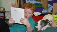 Anjing peliharaan dipercaya dapat membantu dan mendukung anak lebih pintar dan cepat membaca.