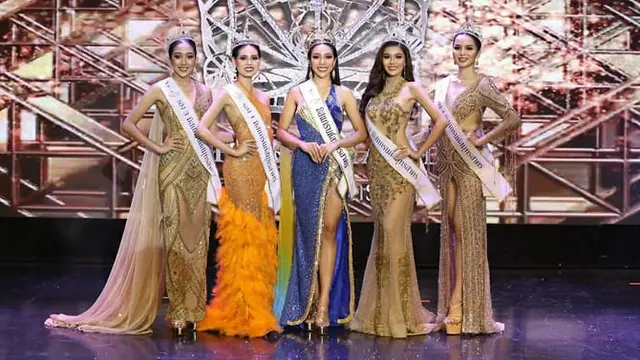 Para kontestan berpose selama kontes kecantikan Miss Grand Samut Sakhon di Bangkok pada 27 Juni 2021. (Foto: AFP/Miss Grand Thailand)