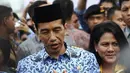 Presiden Joko Widodo menjawab pertanyaan wartawan usai upacara HUT Korps Pegawai Republik Indonesia (Korpri) ke-43 di halaman Monumen Nasional (Monas), Jakarta, Senin (1/12/2014). (Liputan6.com/Faizal Fanani)