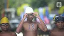 Peserta renang bersiap mengikuti pertandingan pada Kasal CUP 2021 di Pantai Festival Ancol, Jakarta, Sabtu (27/11/2021). Kegiatan tersebut mempertandingkan berbagai jenis olahraga air seperti selam, renang, dayung, layar, jetski, dan ski air. (merdeka.com/Imam Buhori)