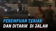 Beredar video seorang perempuan teriak-teriak di pinggir jalan dan ada dua orang pria disampingnya.