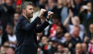 Pelatih sementara Manchester United asal Inggris, Michael Carrick, bereaksi setelah pertandingan Liga Inggris antara Manchester United dan Liverpool di Old Trafford, Manchester, barat laut Inggris, pada 3 Mei 2026. (Darren Staples/AFP)