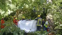 Sebuah pohon yang tumbang menewaskan setidaknya 13 orang dan melukai 49 lainnya dalam upacara keagamaan di Madeira, pulau milik Portugal. (AP)