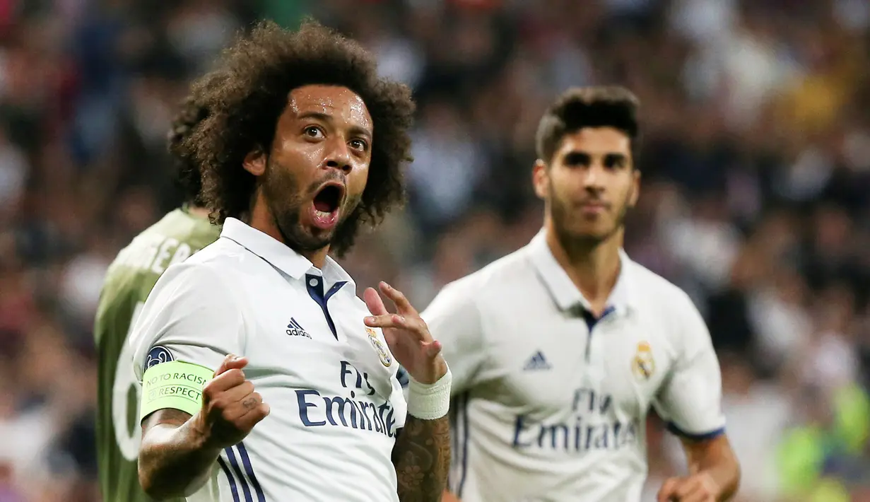 Ekspresi pemain Real Madrid, Marcelo usai timnya menang atas Legia Warszawa pada laga grup F Liga Champions di Santiago Bernabeu stadium, Madrid, Rabu (19/10/2016) dini hari WIB. (REUTERS/Sergio Perez)