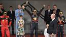 Reaksi pebalap Red Bull, Sergio Perez saat menjuarai Formula 1 GP Monako 2021 pada 29 Mei 2021. Ini menjadi kemanangan ketiga Perez di ajang balap jet darat tersebut. (AFP/Loic Venance)