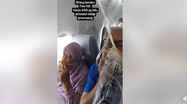 Rekaman video viral yang menunjukkan penumpang pesawat Malaysia Airlines terpaksa menggunakan masker oksigen di tengah penerbangan. (dok. FB Abdul Jalil)