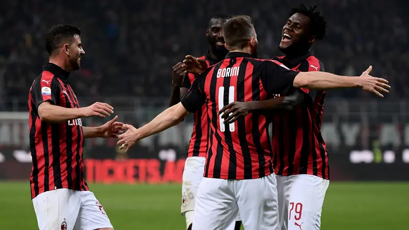 Para pemain AC Milan merayakan gol yang dicetak Franck Kessie ke gawang Empoli pada laga Serie A. (AFP/Marco Bertorello)
