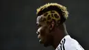 Gaya rambut Paul Pogba  mirip Leopard saat laga Serie A Juventus melawan AS Roma di “Juventus Stadium" , Turin, (24/1/2016). (AFP/Giuseppe Cacace)