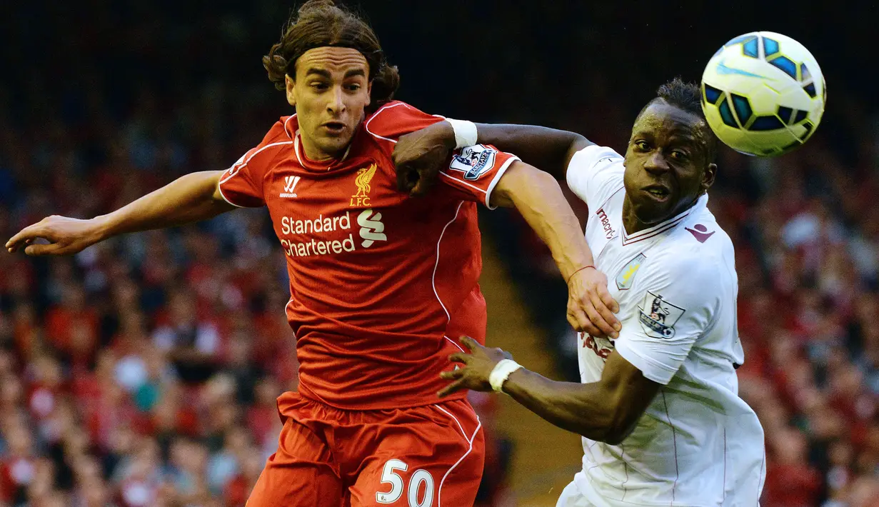 Liverpool sukses memenangkan perburuan sayap kanan Benfica, Lazar Markovic (kiri) yang diperebutkan beberapa klub besar Eropa pada awal musim 2014/2015. Pemain yang mendapat julukan Messi dari Serbia ini nyatanya hanya semusim bermain untuk Liverpool yaitu pada musim pertamanya. Total tampil dalam 34 laga di semua kompetisi, ia hanya mencetak 3 gol. Sempat dipinjamkan ke beberapa klub, seperti Fenerbahce, Sporting Lisbon, Hull City, Anderlecht dan Fulham hingga 2018/2019, ia akhirnya dilepas permanen ke Partizan pada 2019/2020. (AFP/Paul Ellis)