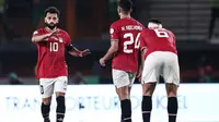 Kapten Timnas Mesir, Mohamed Salah yang kini tengah menjalani musim ke-7 bersama Liverpool telah mencetak 1 gol dalam 2 laga di fase Grup B Piala Afrika 2023. Satu gol tersebut dicetaknya saat Mesir bermain imbang 2-2 dengan Mozambik pada laga pertama (14/1/2024). (AFP/Franck Fife)
(AFP/Franck Fife)