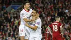 Striker Sevilla, Wissam Ben Yedder, melakukan selebrasi bersama Jesus Navas usai mencetak gol ke gawang Liverpool pada laga Liga Champions di Stadion Anfield, Kamis (14/9/2017). Liverpool ditahan imbang 2-2 oleh Sevilla. (AP/Frank Augstein)