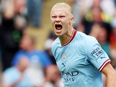 Manchester City sangat beruntung mendapat servis pemain sekelas Erling Haaland. Bomber yang ditebus seharga 75 juta Euro dari Dortmund itu tak henti-henti merobek gawang lawan. Sejauh ini ia telah mencetak 21 gol untuk City liga Inggris. (AFP/Nigel Roddis)