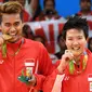 Pasangan ganda campuran, Liliyana Natsir dan Tontowi Ahmad menjadi peraih medali emas Olimpiade Rio De Janeiro 2016 setelah kalahkan pebulutangkis Malaysia, Liu Ying Goh dan Peng Soon Chan. Mereka berhasil menghentikan puasa gelar pada ajang Olimpiade sebelumnya. (Foto: AFP/Goh Chai Hin)