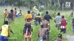 Enam orang terkena anak panah dalam pertikaian antarpendukung pasangan calon pada momentum pemungutan suara ulang.
