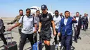 Pemain Al-Nassr, Cristiano Ronaldo berjalan ke luar dari Imam Khomeini International Airport, Tehran pada Selasa (19/09/2023). Al-Nassr akan melakoni laga grup G Liga Champions Asia 2023 melawan Persepolis FC pada Rabu (20/09/2023). (AFP/Payam Parsae)